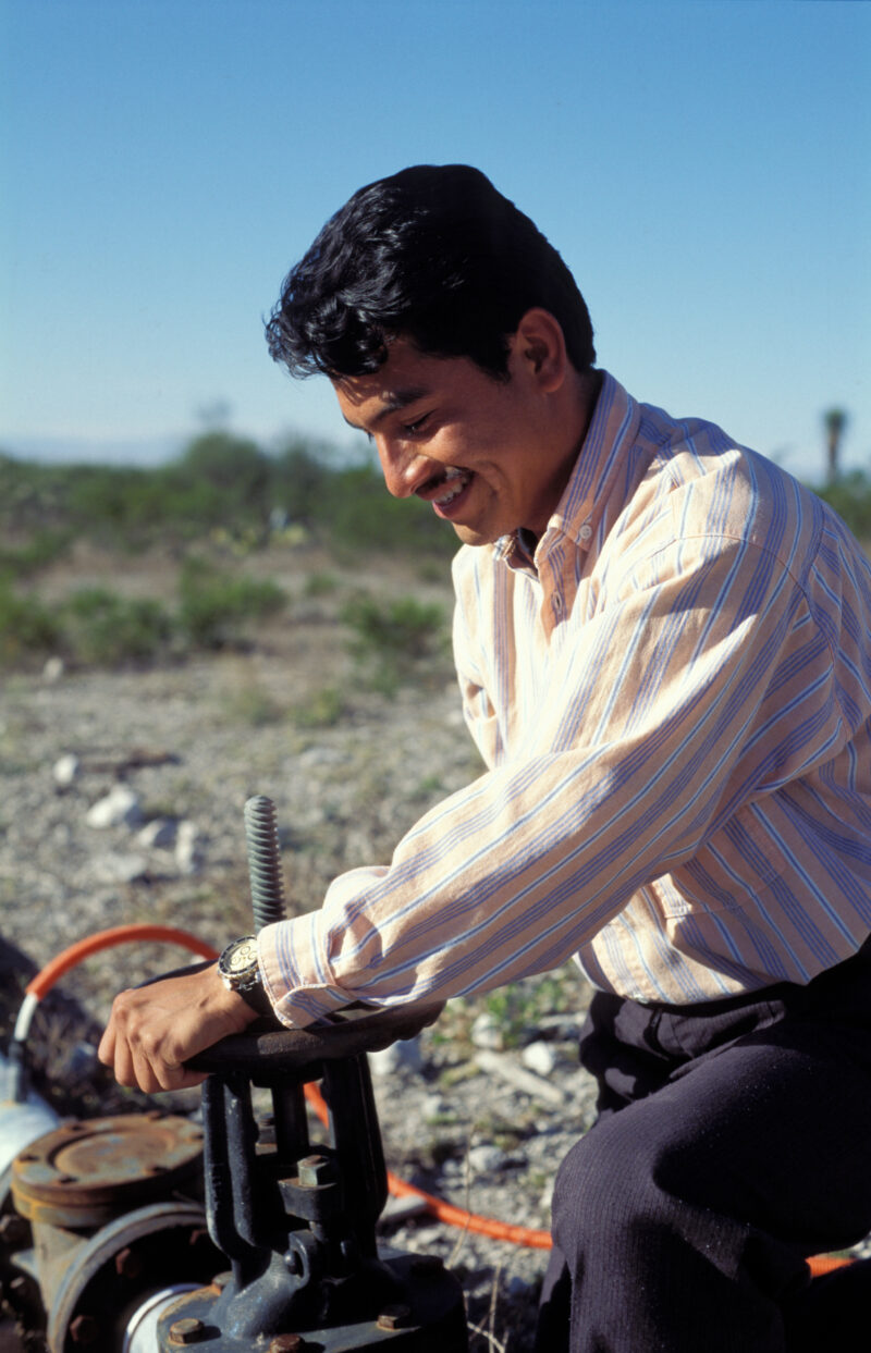 Turning on the Water for a Village — ADRA worker turns on the new water system installed for a desert community in Mexico. — Mexico, water system, man