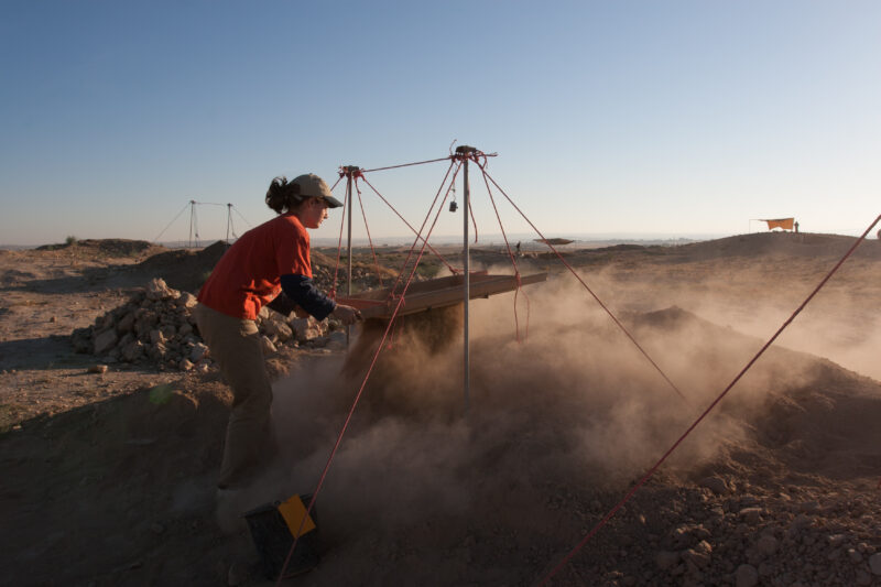 Sifting for Treasure — Students and Local workers, hired for the dig session, sift through the dirt that comes out of the squares, to catch small items like ...