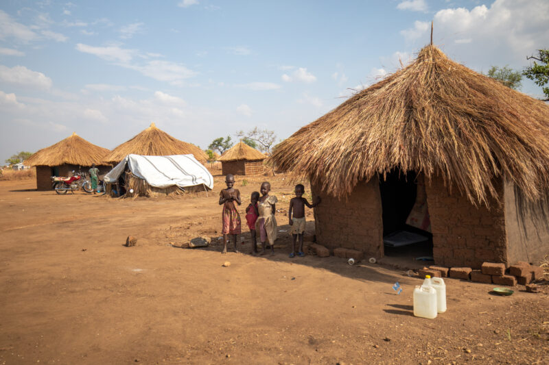 Refugee Housing — Refugees from South Sudan given a small plot of land in their host country of Uganda to build a small house. — Person, Refugee, Refugee Set...