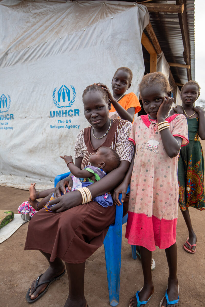 Arriving in Uganda — After fleeing their homeland, refugees arrive in Uganda. — Child, Eyes Open, Female, Frontal Face, Group