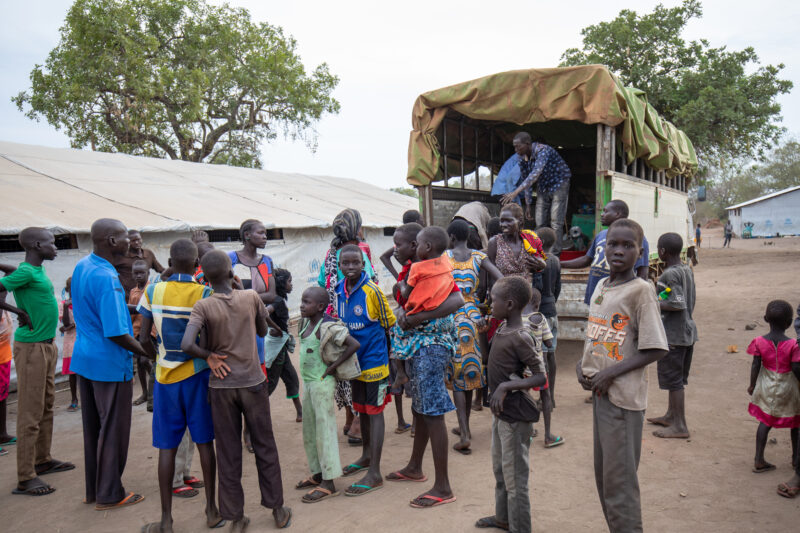 Arriving in Uganda — After fleeing their homeland, refugees arrive in Uganda. — Child, Eyes Open, Frontal Face, Group, Male