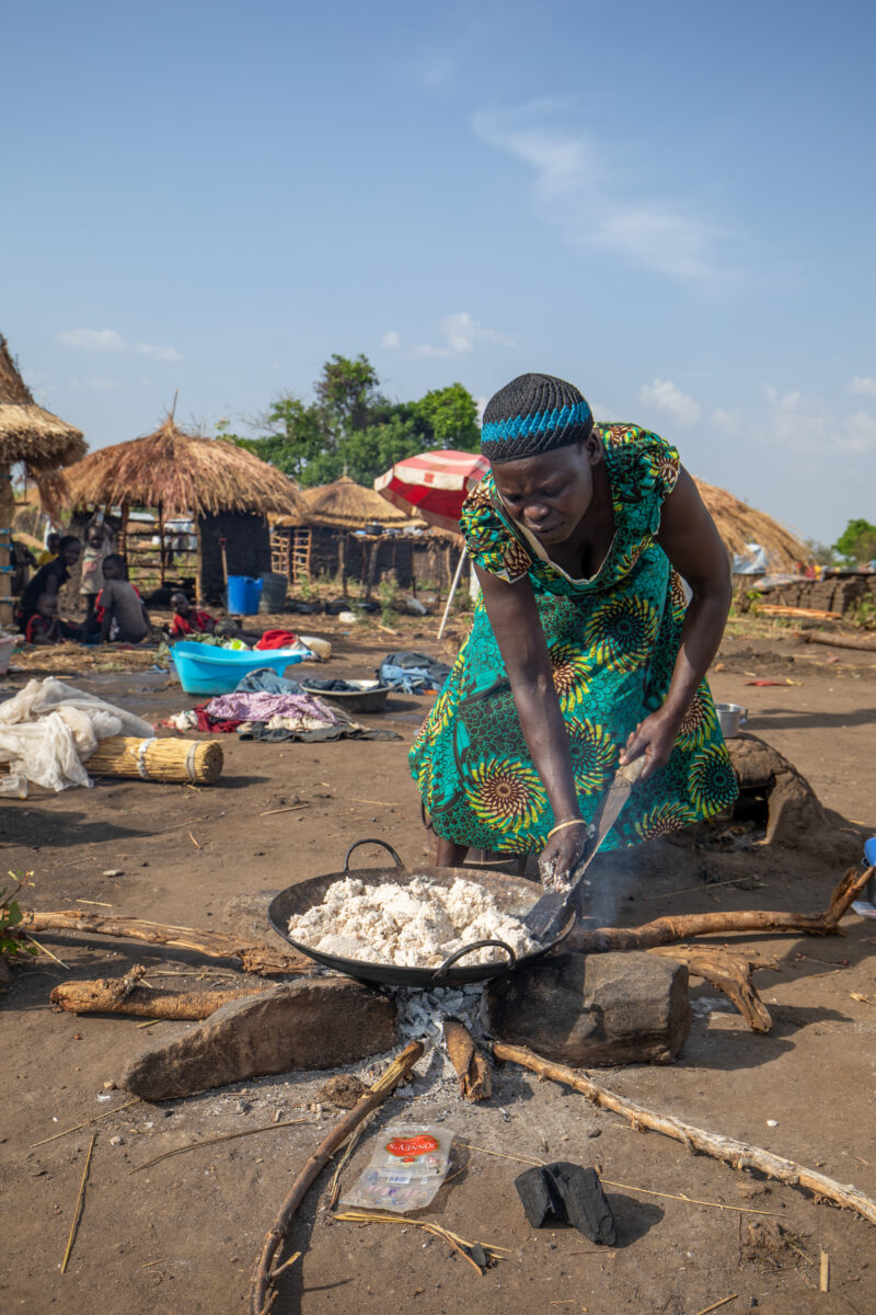Refugees in Uganda — Refugees from South Sudan settle into their new home at a refugee settlement in Uganda. — Adult, Complementary Colors, Eyes Closed, Fema...