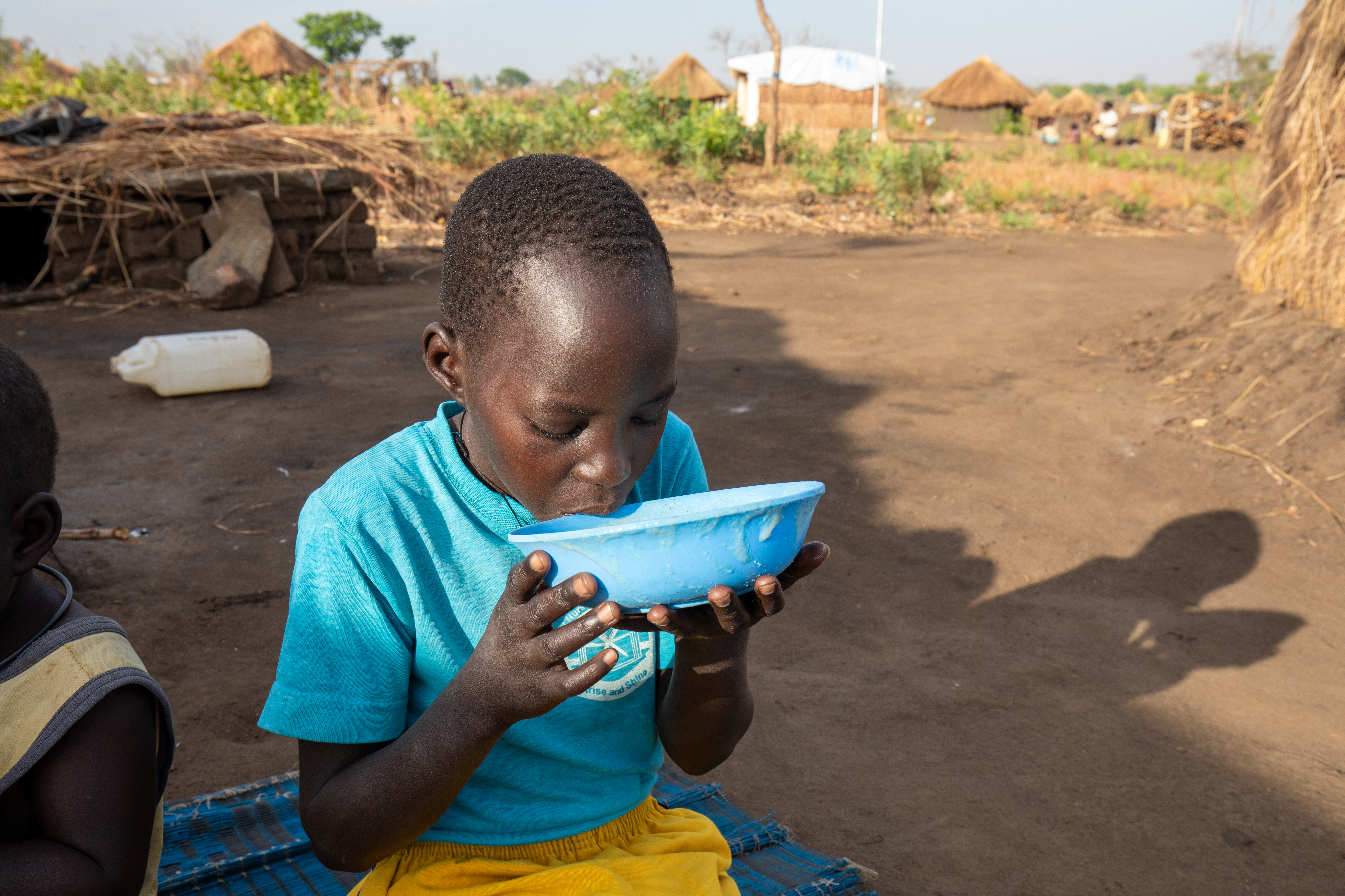 Refugee Child Eating