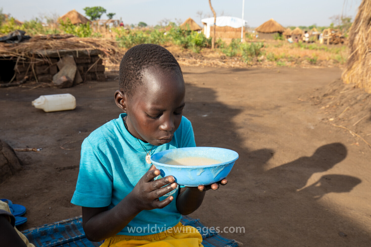 Refugee Child Eating
