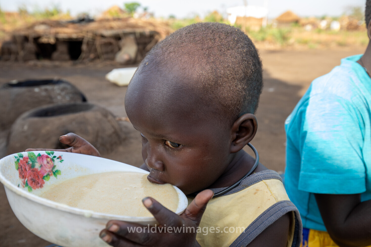 Refugee Child Eating