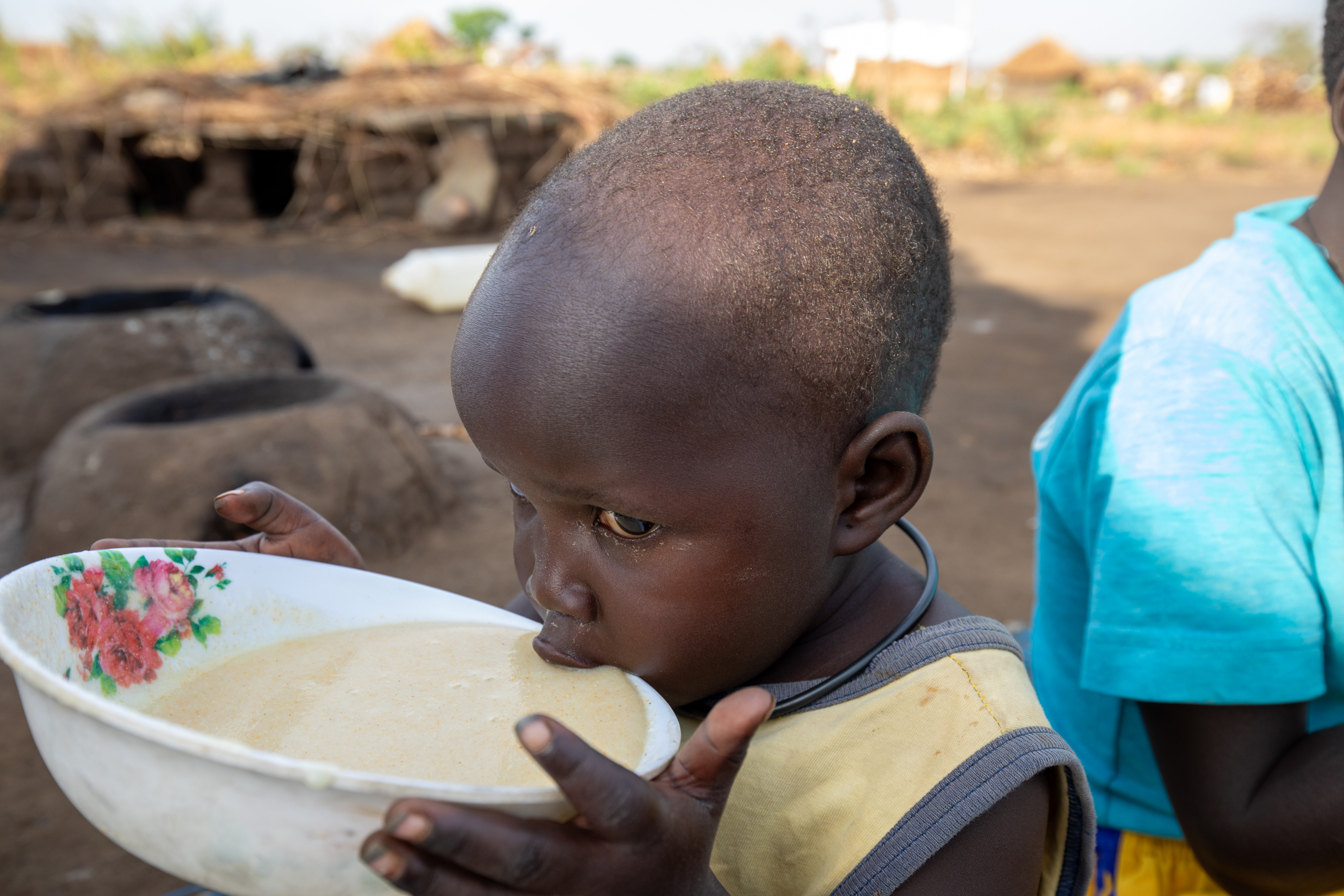 Refugee Child Eating