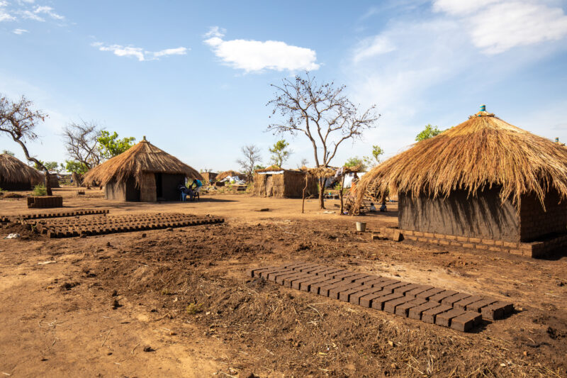Building a House — Refugees from South Sudan build a small house in the Refugee Settlement that have been invited to by Uganda. — Complementary Colors, Refug...