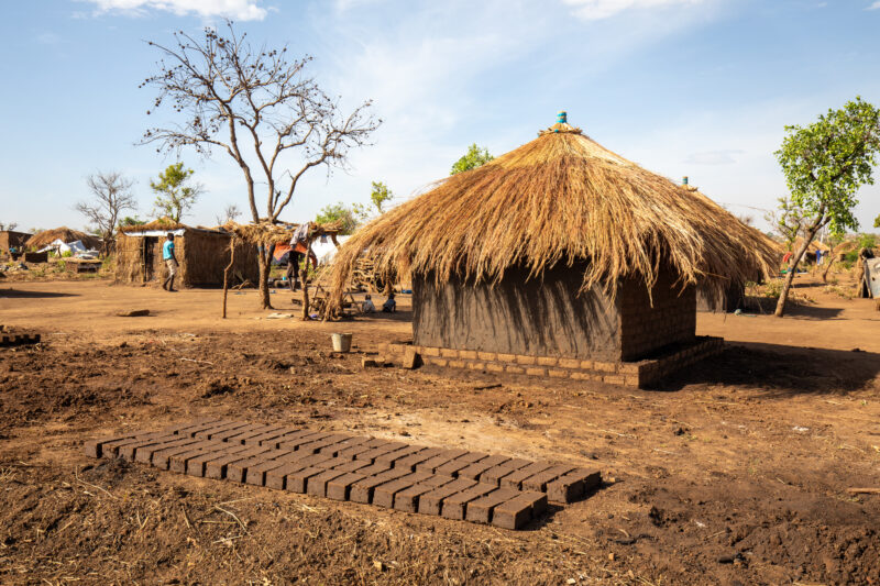 Building a House — Refugees from South Sudan build a small house in the Refugee Settlement that have been invited to by Uganda. — Complementary Colors, Refug...