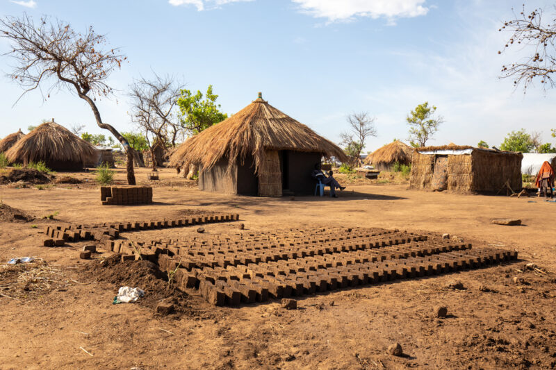 Building a House — Refugees from South Sudan build a small house in the Refugee Settlement that have been invited to by Uganda. — Complementary Colors, Refug...