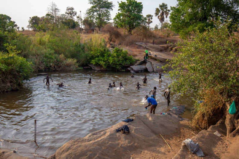 Swimming Hole — Children in Uganda bath and swim in the village river. — Nature, River, Niger River, Water hole, Swimming