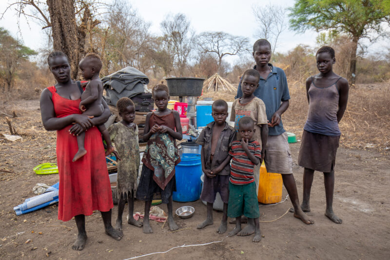 Refugees from South Sudan — After walking 100 Km, refugees arrive to the safety of Uganda. — Adult, Child, Eyes Open, Female, Frontal Face