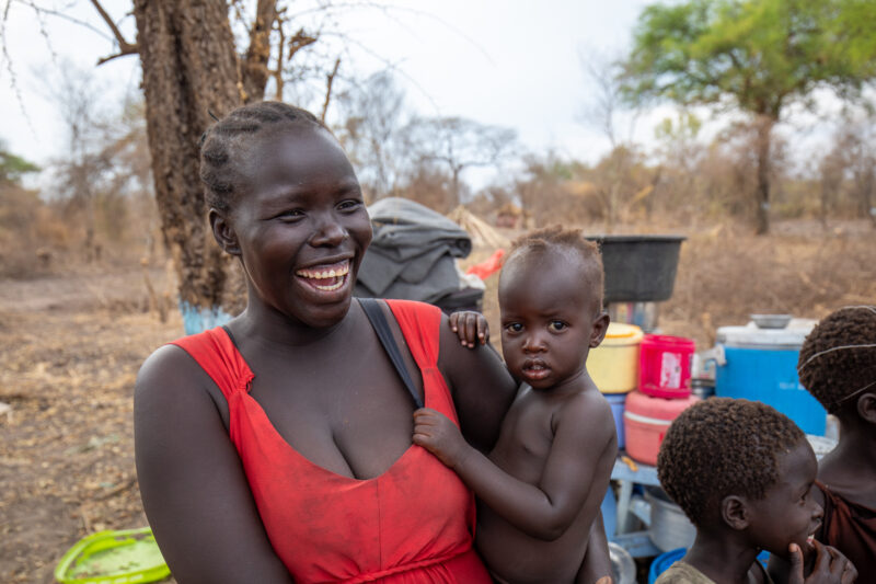 Refugees from South Sudan — After walking 100 Km, refugees arrive to the safety of Uganda. — Adult, Child, Eyes Open, Frontal Face, Male