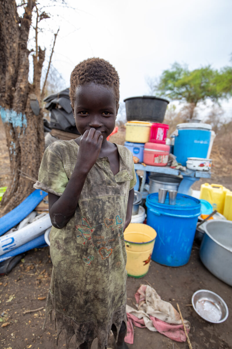 Refugees from South Sudan — After walking 100 Km, refugees arrive to the safety of Uganda. — Boat, Child, Eyes Open, Frontal Face, One Face