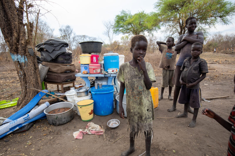 Refugees from South Sudan — After walking 100 Km, refugees arrive to the safety of Uganda. — Child, Eyes Open, Female, Frontal Face, Group