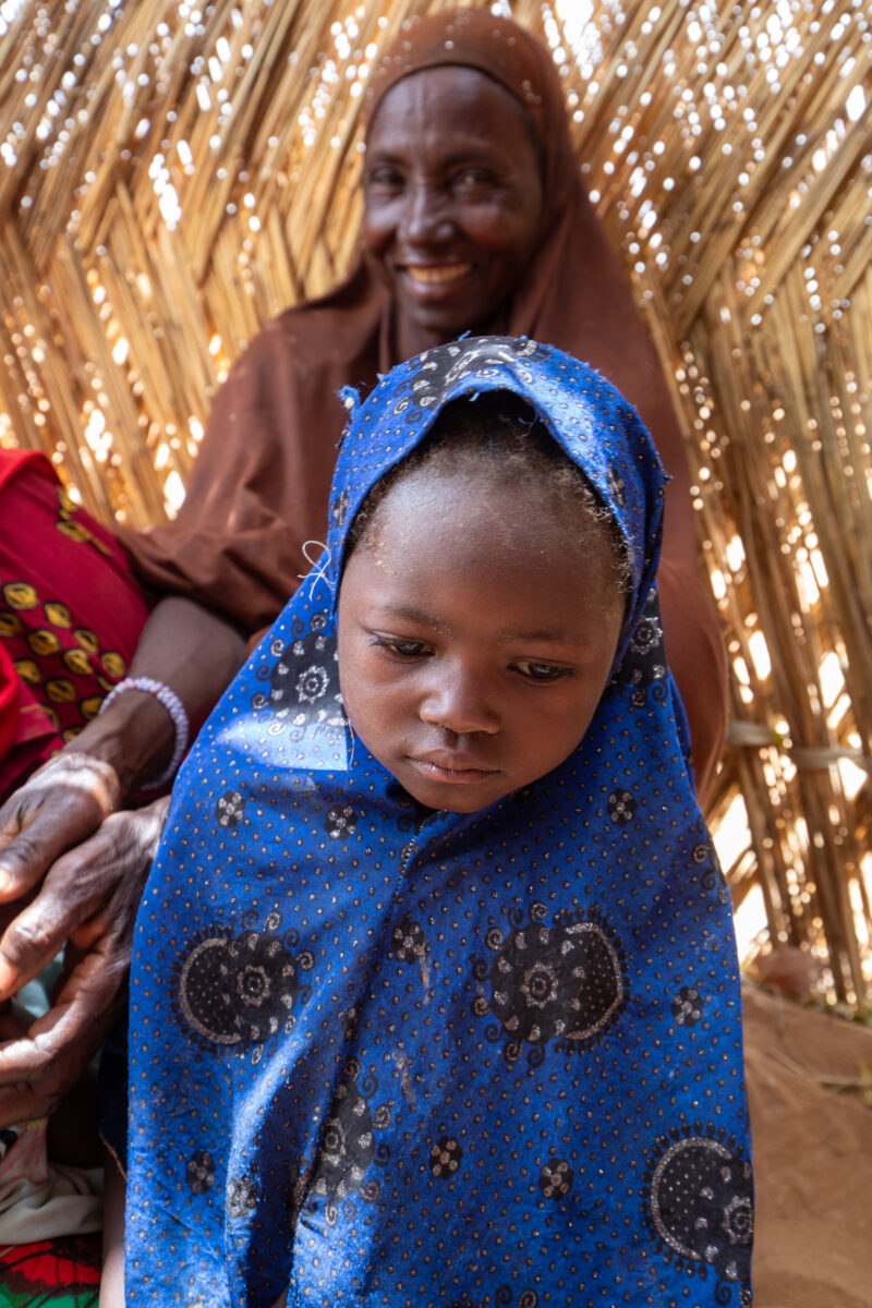 Temporary Classroom — Students in Niger, Africa, attend school in a classroom made of mud and sticks. — Adult, Africa, Baby, Complementary Colors, Education