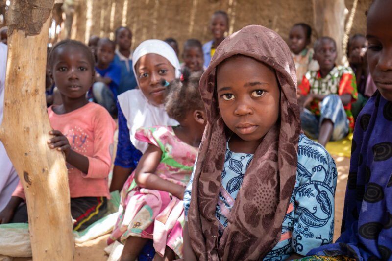 Temporary Classroom — Students in Niger, Africa, attend school in a classroom made of mud and sticks. — Adult, Africa, Beard, Child, Education