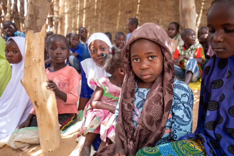 Temporary Classroom — Students in Niger, Africa, attend school in a classroom made of mud and sticks. — Adult, Africa, Boat, Child, Education