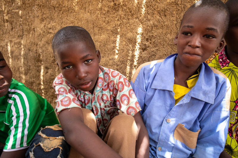 Temporary Classroom — Students in Niger, Africa, attend school in a classroom made of mud and sticks. — Africa, Child, Education, Eyes Open, Female