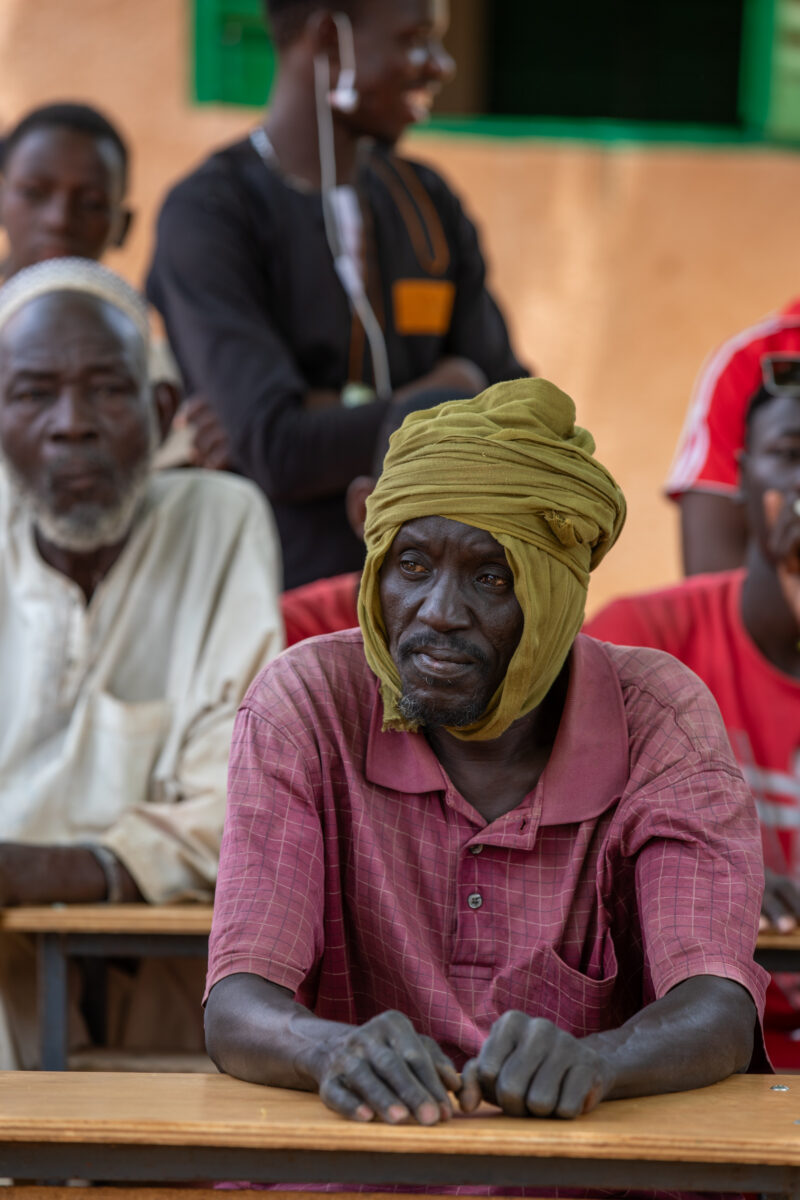 Parents Attend Meeting — Parents in Rural Niger attend a parrent teacher meeting. — Adult, Africa, Beard, Education, Eyes Open
