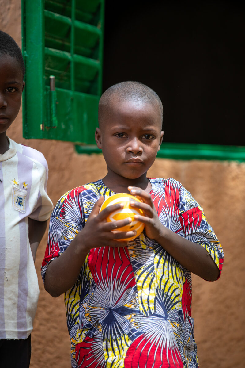 Students Outside their New School — Happy Student stand outside their new school provided by ADRA Norway — Africa, Ball, Ball Game, Child, Education