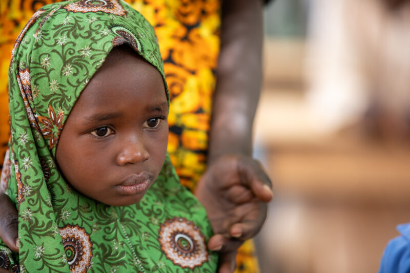 Students Outside their New School — Happy Student stand outside their new school provided by ADRA Norway — Africa, Child, Education, Eyes Open, Frontal Face