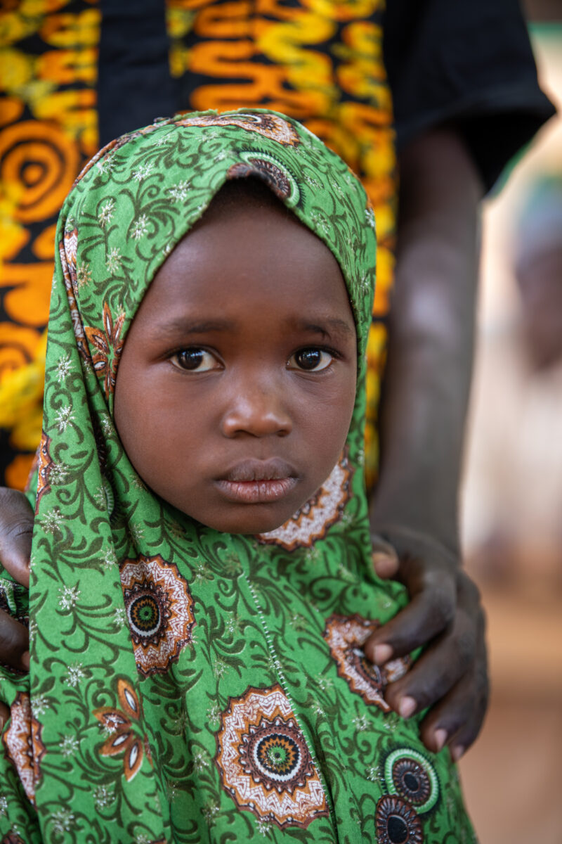 Students Outside their New School — Happy Student stand outside their new school provided by ADRA Norway — Africa, Child, Education, Eyes Open, Female