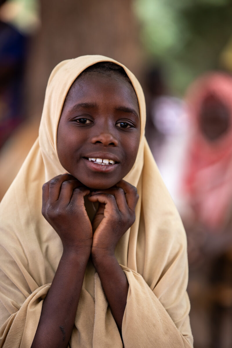 Students Outside their New School — Happy Student stand outside their new school provided by ADRA Norway — Africa, Child, Education, Eyes Open, Frontal Face