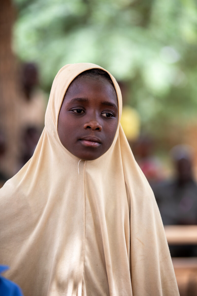 Students Outside their New School — Happy Student stand outside their new school provided by ADRA Norway — Africa, Education, Eyes Open, Female, Frontal Face