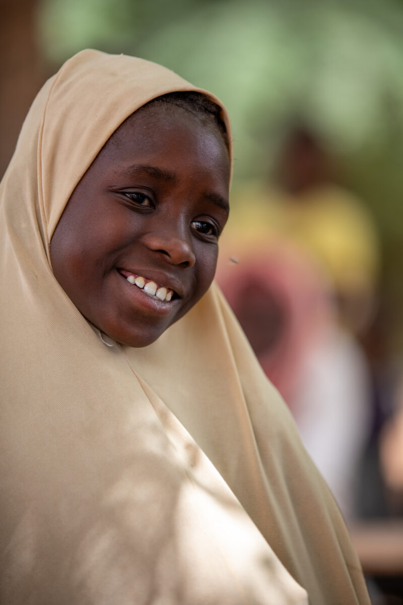 Students Outside their New School — Happy Student stand outside their new school provided by ADRA Norway — Adult, Africa, Education, Eyes Open, Frontal Face