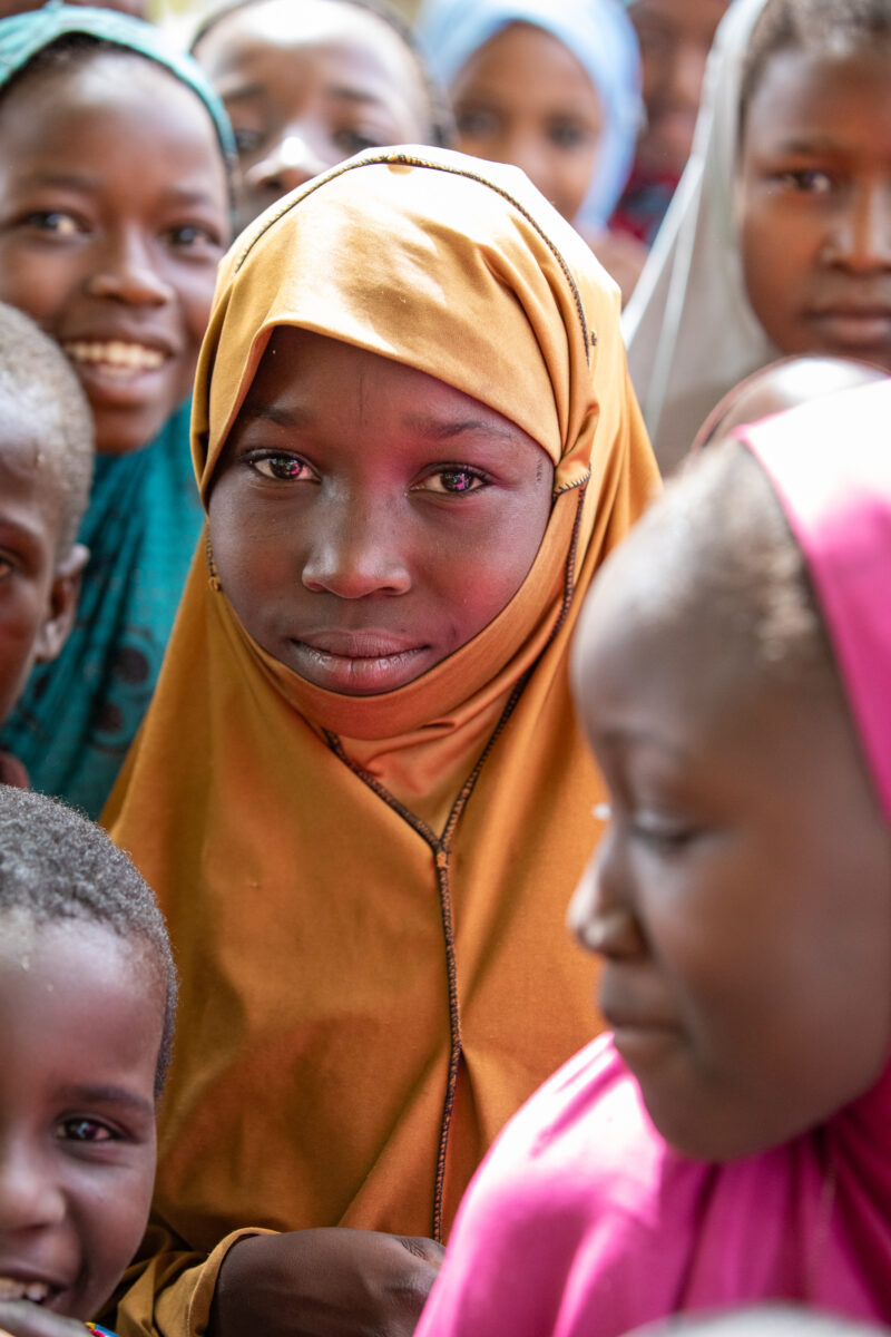 Students Outside their New School — Happy Student stand outside their new school provided by ADRA Norway — Africa, Child, Education, Eyes Open, Female