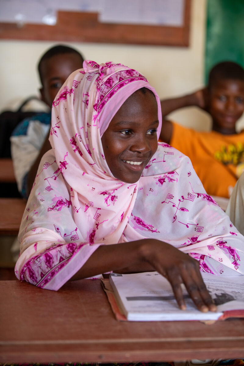 Girl in Niger Attends School — With a long tradition of early marriage, most girls in Niger drop out of school after the second grade — Adult, Africa, Educat...