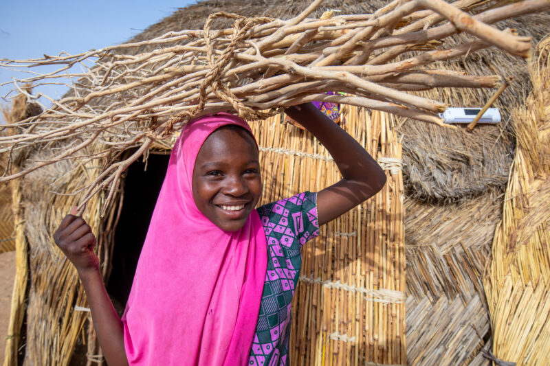 Collecting Firewood — Girl with the firewood that she has collected to cook the meal. — Africa, Colorful, Education, Eyes Open, Female