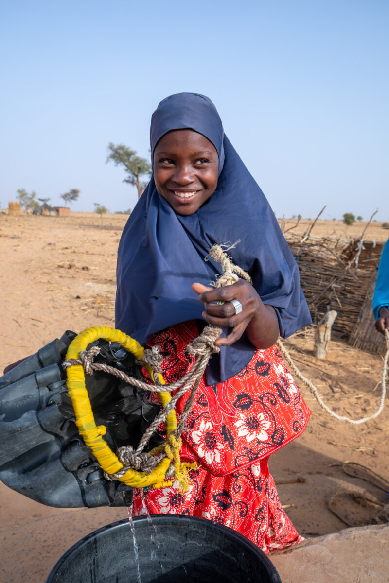 Collecting Water in Niger — A daily task in many regions of rural Africa is the trip to a water source to collect water. — Africa, Education, Eyes Open, Fema...
