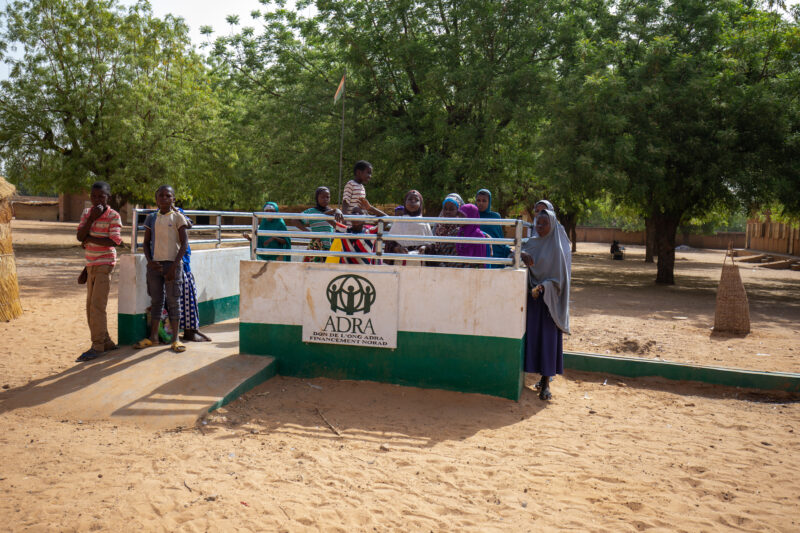 ADRA Well — Students get a refreshing drink at a well at their school provided by ADRA — Africa, Boat, Child, Education, Eyes Open