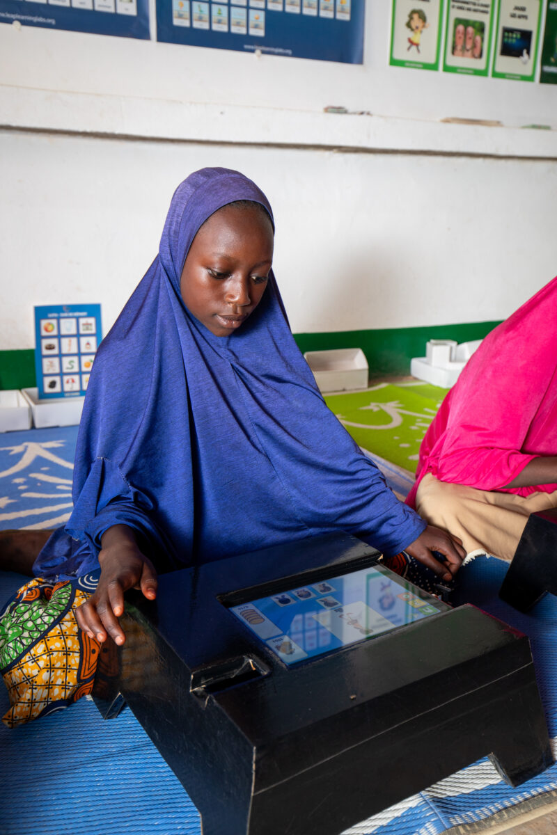 Computer Class in Niger — Young students in Niger learn computer skills on tablets provided to their school by Norway. — Africa, Child, Education, Eyes Close...
