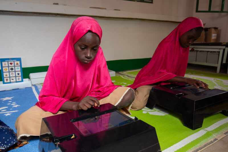 Computer Class in Niger — Young students in Niger learn computer skills on tablets provided to their school by Norway. — Adult, Africa, Education, Eyes Close...