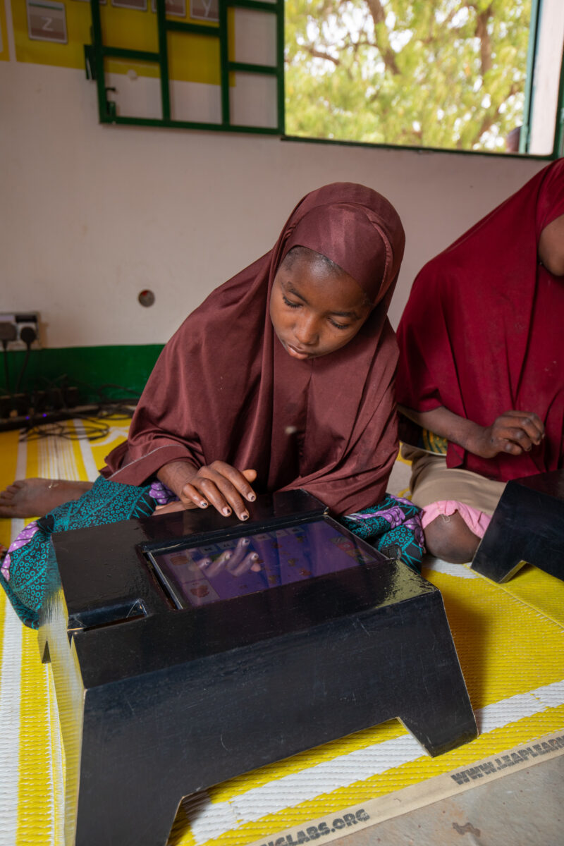 Computer Class in Niger — Young students in Niger learn computer skills on tablets provided to their school by Norway. — Adult, Africa, Education, Eyes Close...