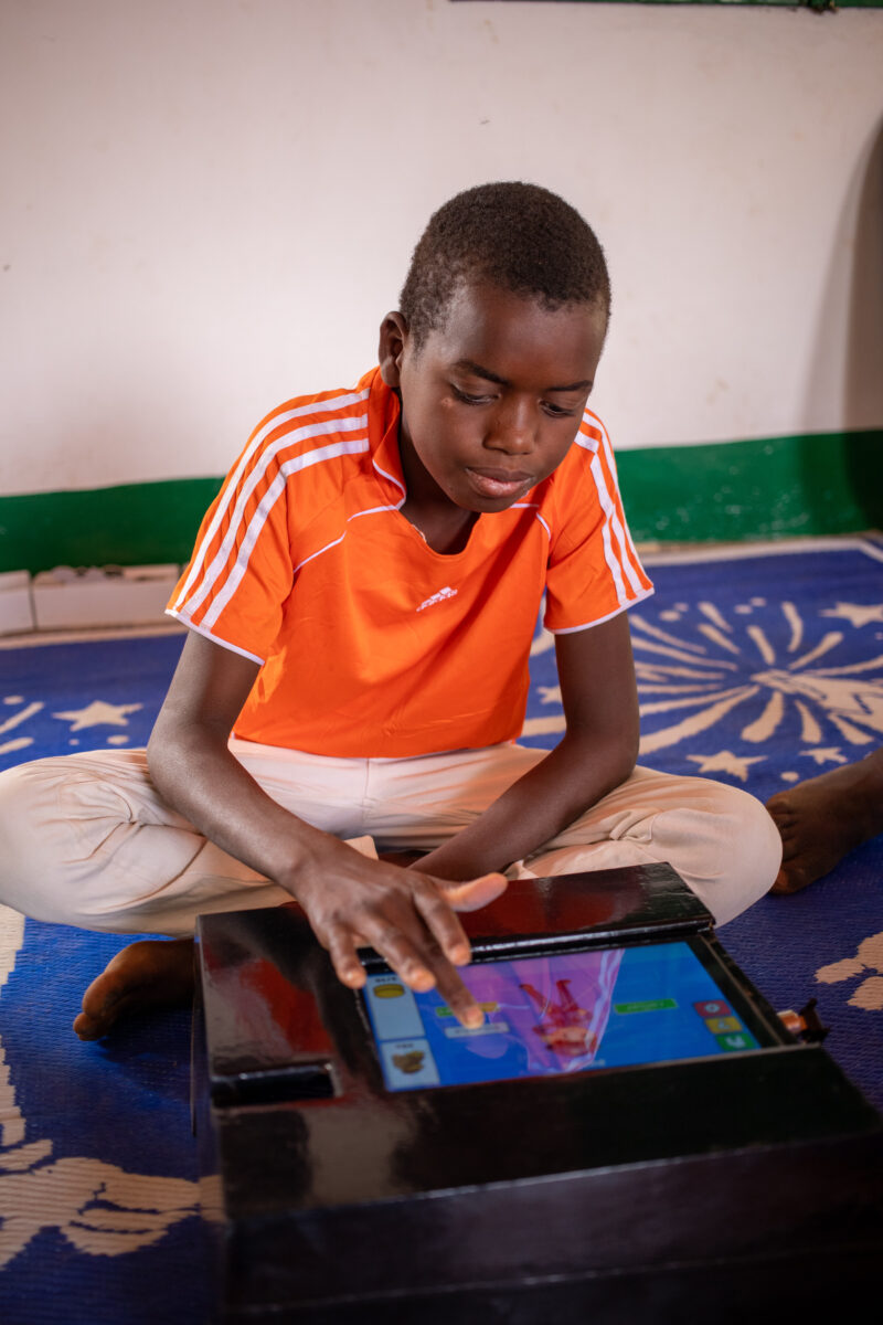 Computer Class in Niger — Young students in Niger learn computer skills on tablets provided to their school by Norway. — Africa, Child, Education, Eyes Close...