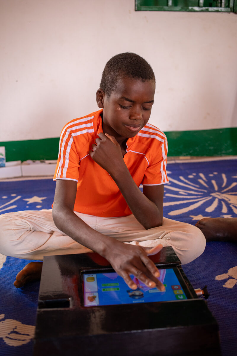 Computer Class in Niger — Young students in Niger learn computer skills on tablets provided to their school by Norway. — Africa, Child, Education, Eyes Close...