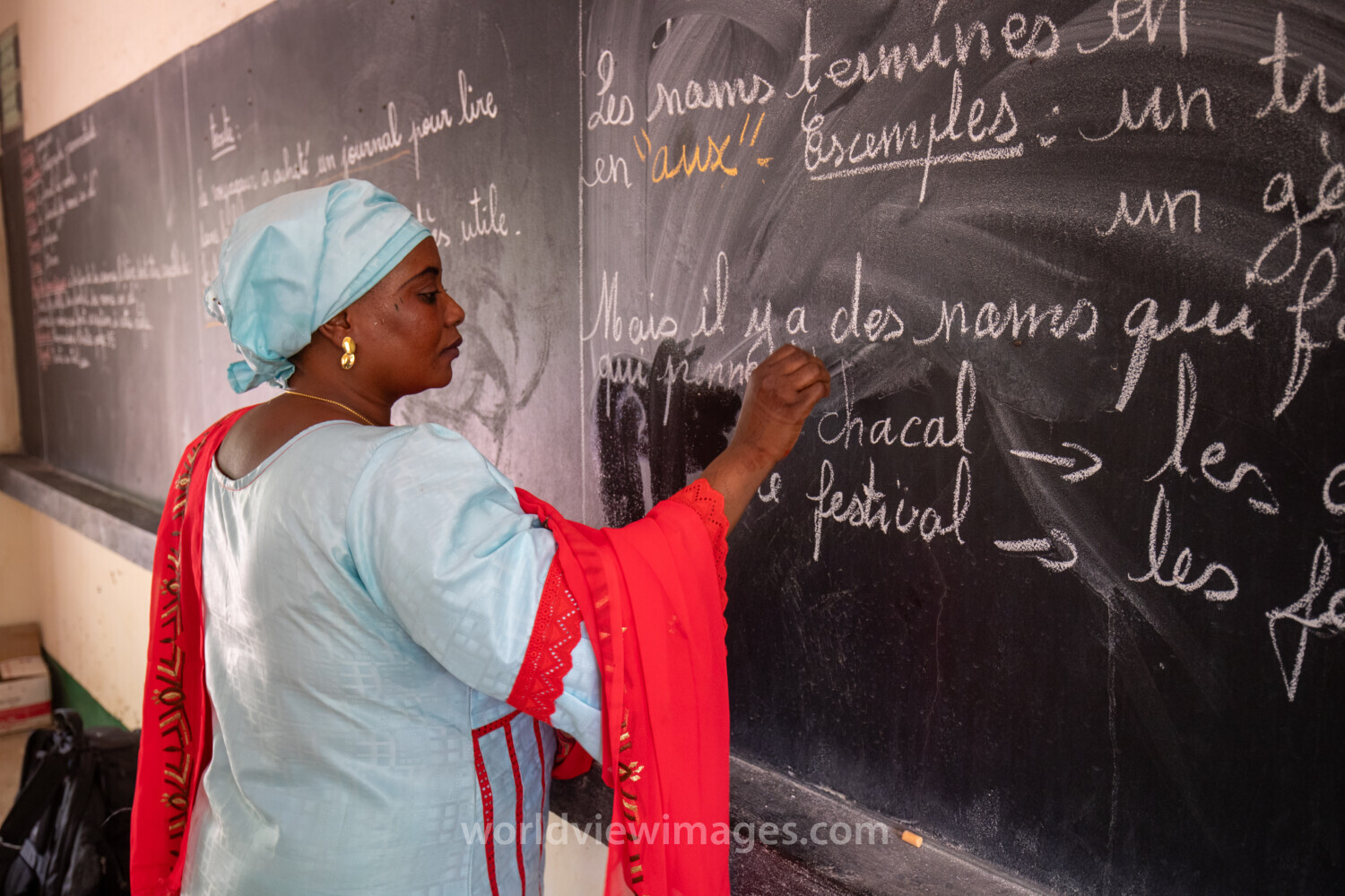 Teacher at Blackboard