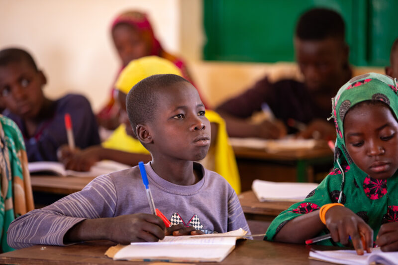 Boy in School in Niger — Young boy attends school in Niger, Africa — Adult, Africa, Education, Eyes Closed, Eyes Open