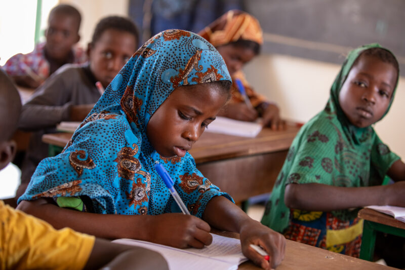Girl in Niger Attends School — With a long tradition of early marriage, most girls in Niger drop out of school after the second grade — Adult, Africa, Child,...