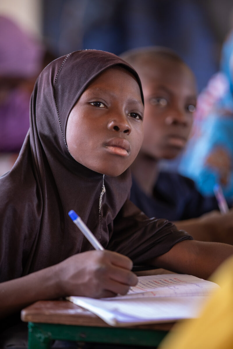 Girl in Niger Attends School — With a long tradition of early marriage, most girls in Niger drop out of school after the second grade — Adult, Africa, Educat...