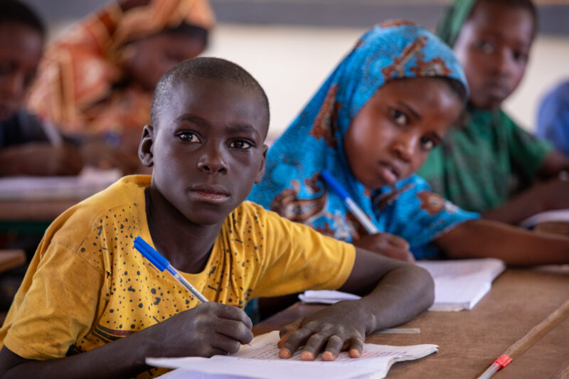 Boy in School in Niger — Young boy attends school in Niger, Africa — Adult, Africa, Child, Education, Eyes Open