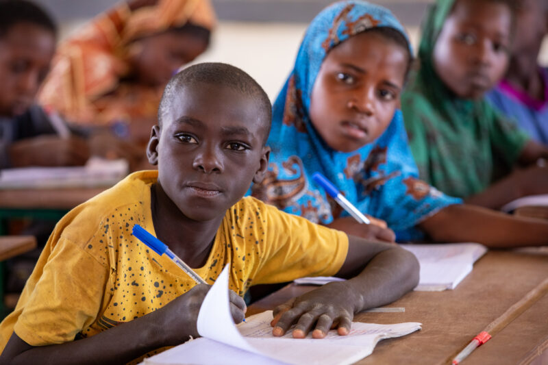 Boy in School in Niger — Young boy attends school in Niger, Africa — Africa, Child, Education, Eyes Open, Frontal Face