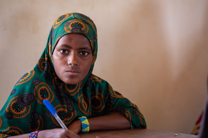 Girl in Niger Attends School — With a long tradition of early marriage, most girls in Niger drop out of school after the second grade — Africa, Close-Up, Edu...