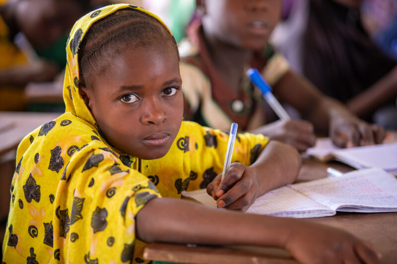 Girl in Niger Attends School — With a long tradition of early marriage, most girls in Niger drop out of school after the second grade — Africa, Child, Educat...