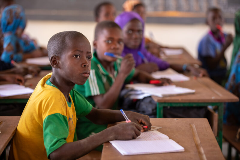 Boy in School in Niger — Young boy attends school in Niger, Africa — Adult, Africa, Beard, Education, Eyes Open