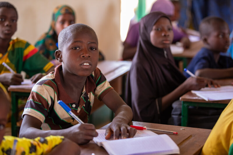 Boy in School in Niger — Young boy attends school in Niger, Africa — Adult, Africa, Education, Eyes Open, Female