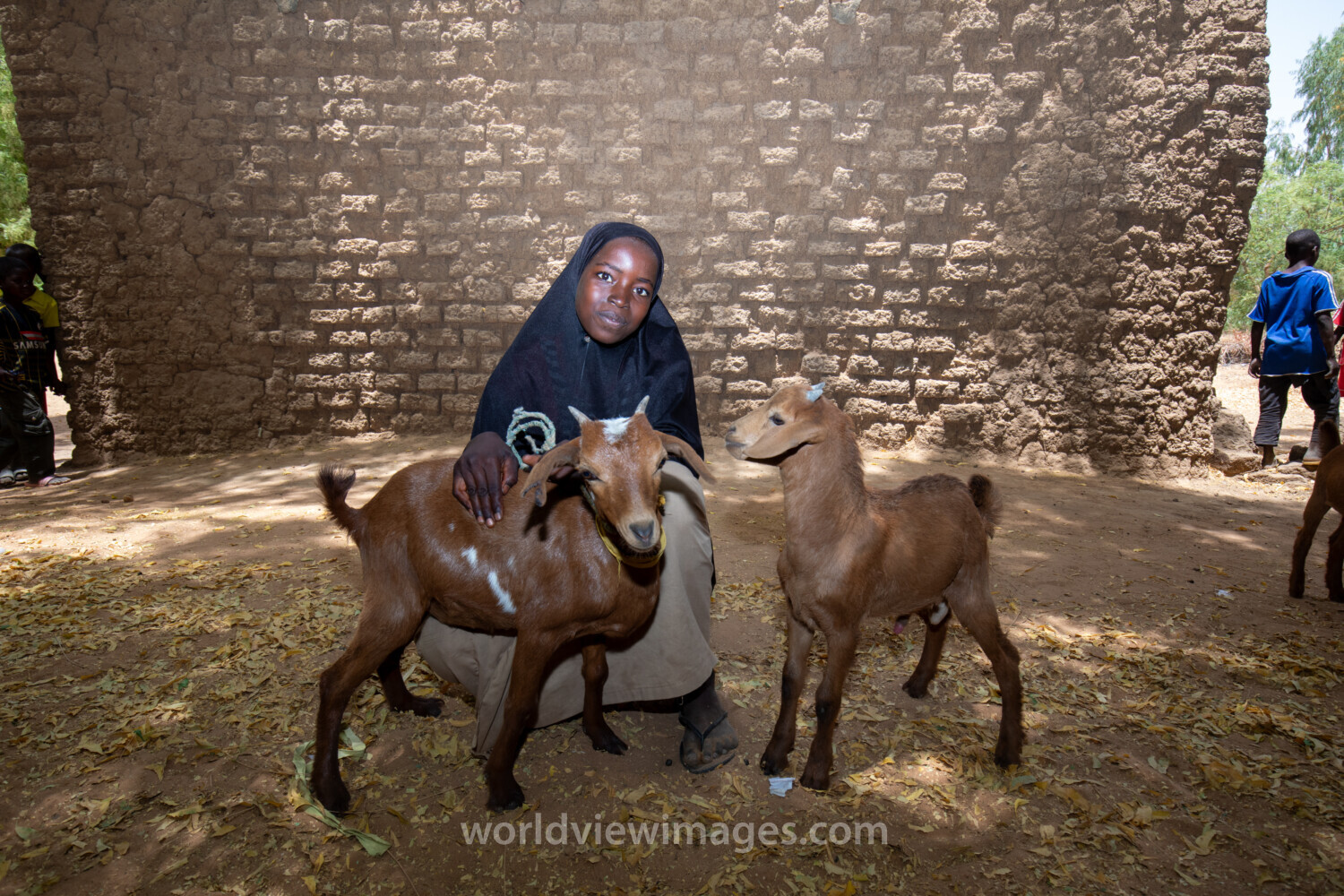 Girl and her Goat in Niger